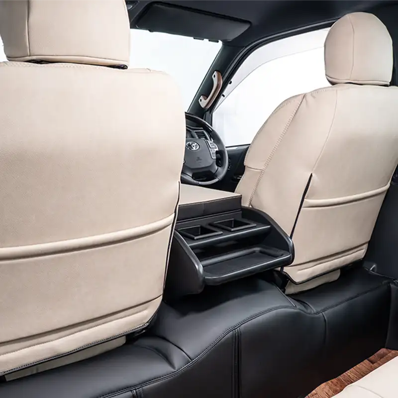 Seatback pocket on a HIACE equipped with Luxe Series seat covers.